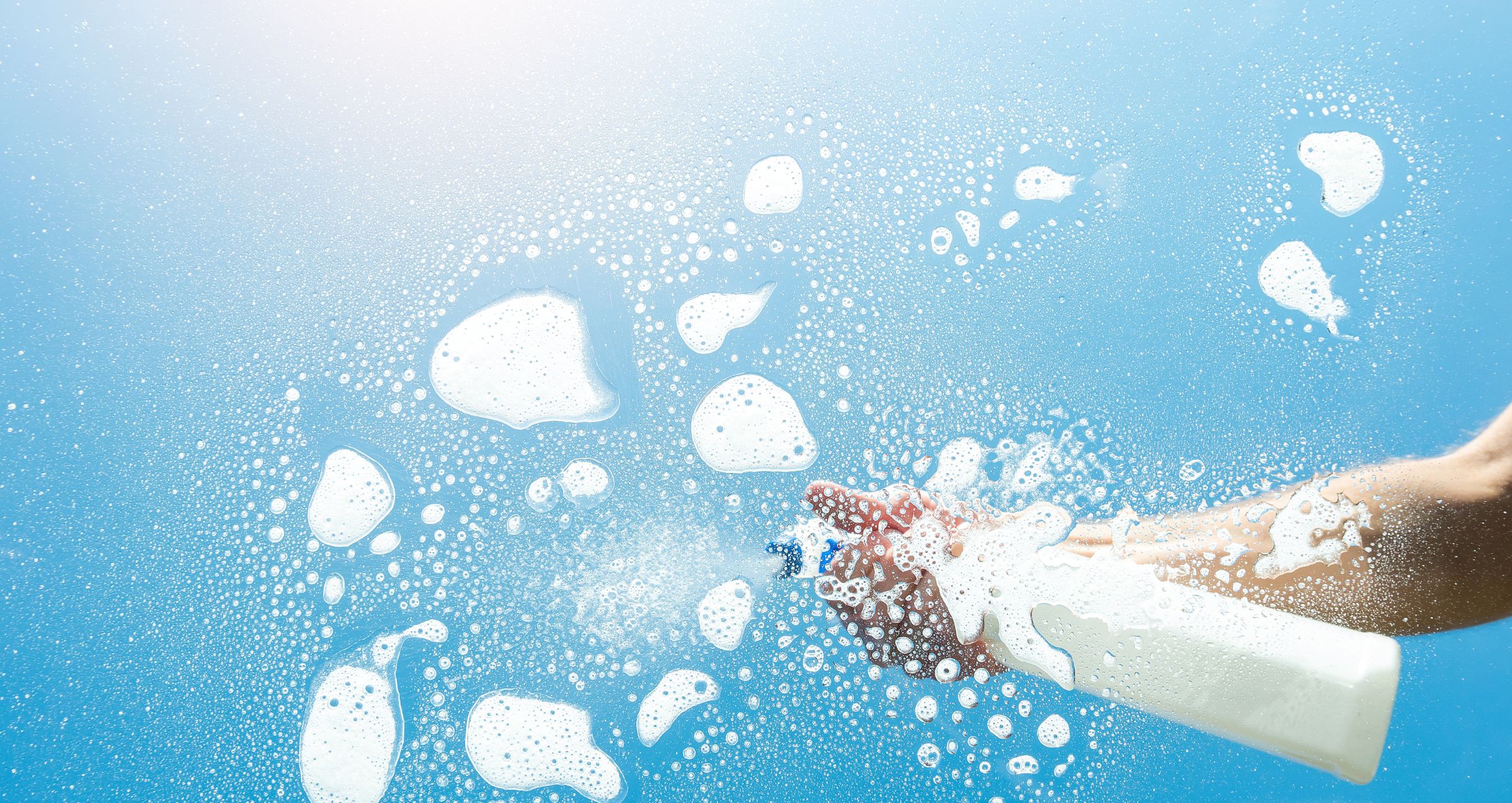 Image of a spray bottle being sprayed on glass - Blog post is about the latest wordpress update